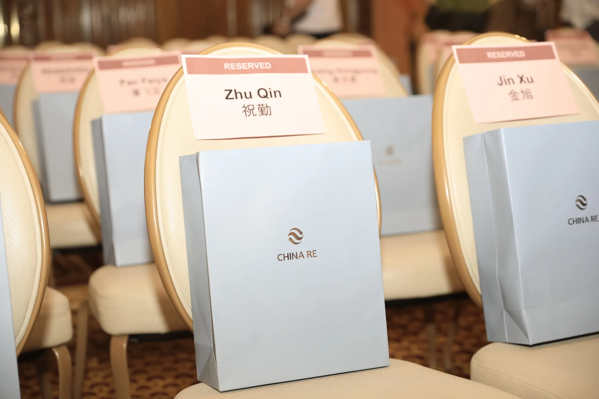 Reserved seats with name cards and China Re gift bags