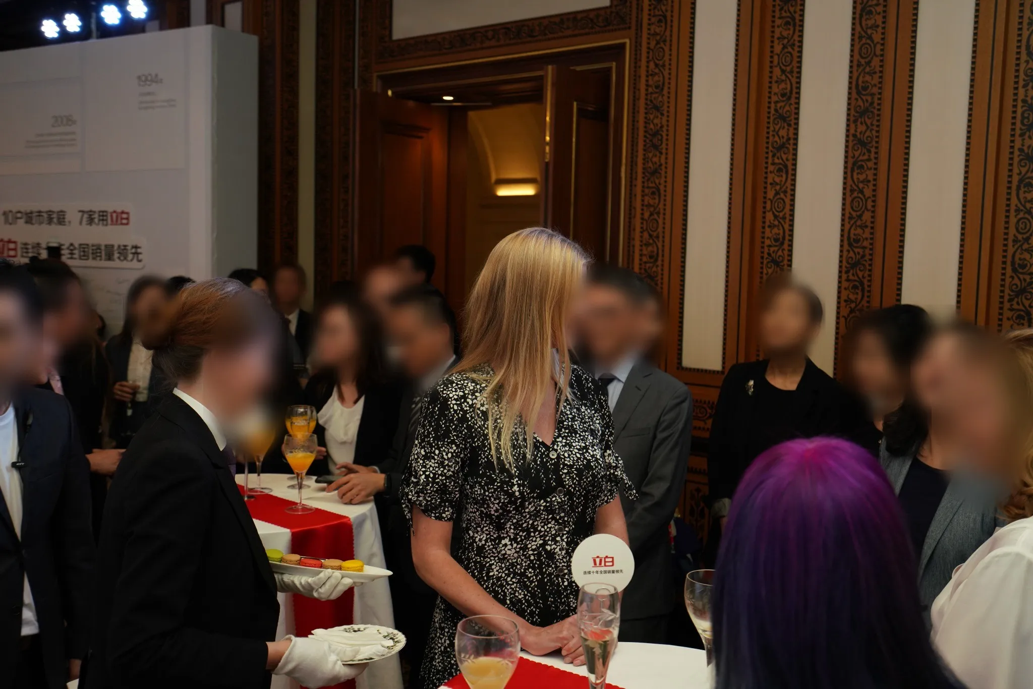 Guests gathered with drinks at the launch reception