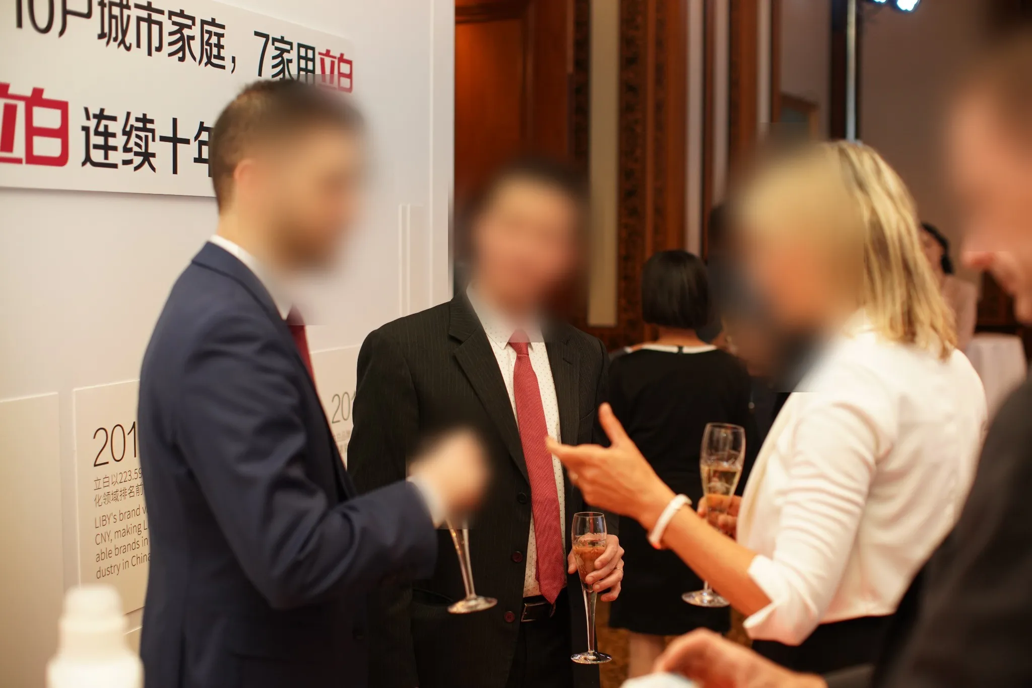 Guests in conversation beside the product display cabinets