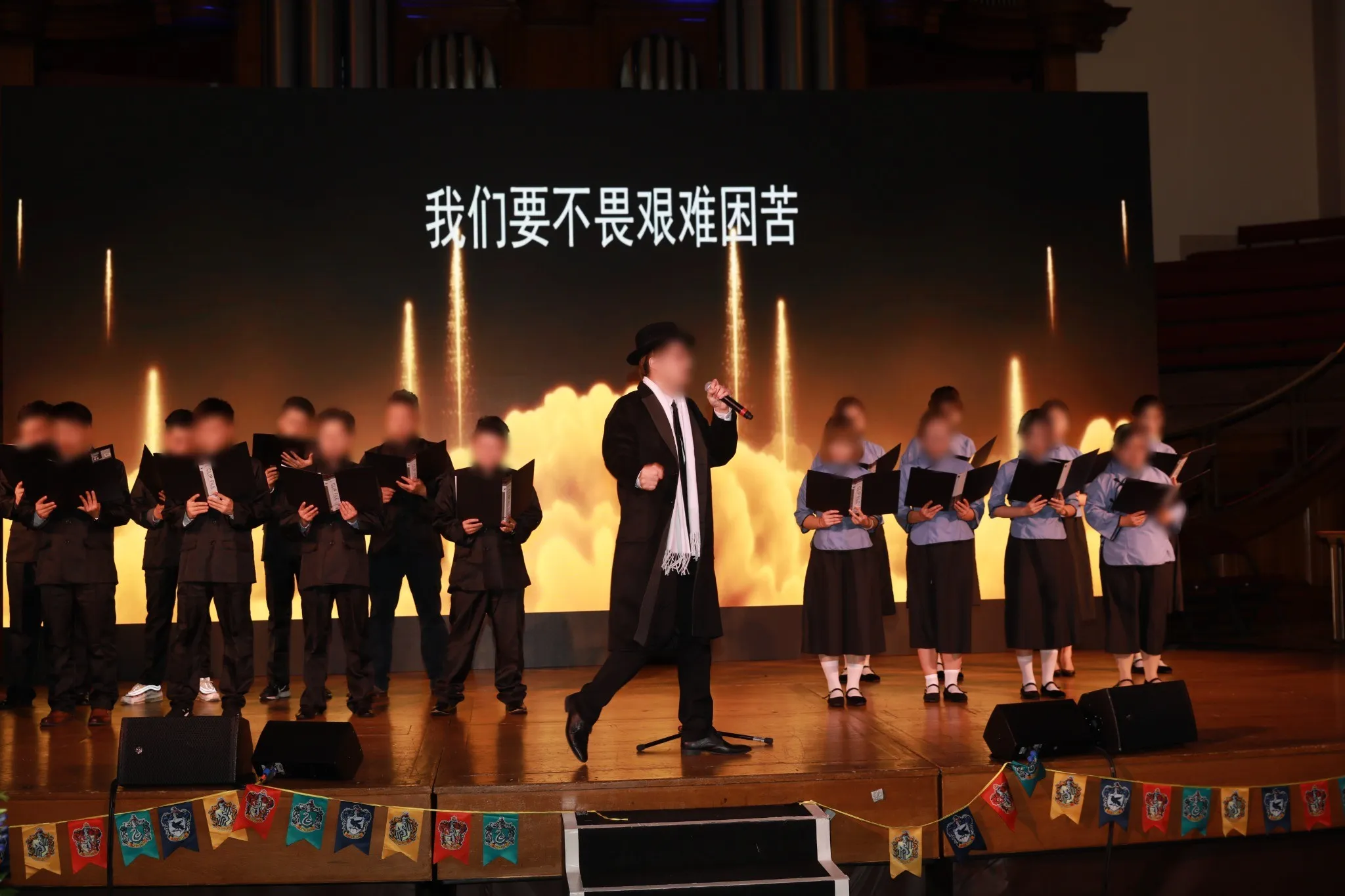 A live performance on the awards stage with pyrotechnic effects behind the performers