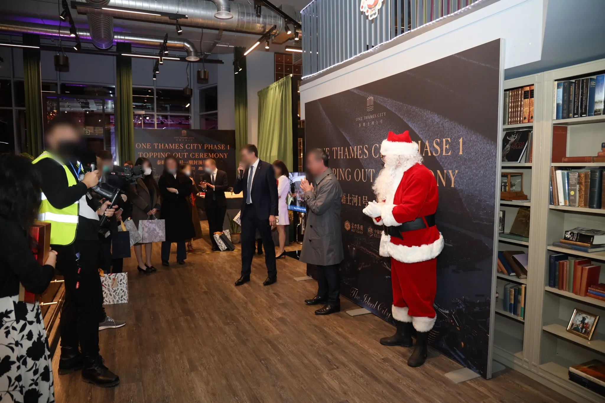 Guests and press gathered at the indoor ceremony
